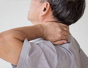 patient suffering with neck pain